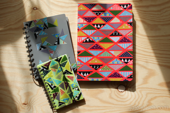 verschiedene mit Washi Tape Dreiecken gestaltete Notizbuecher