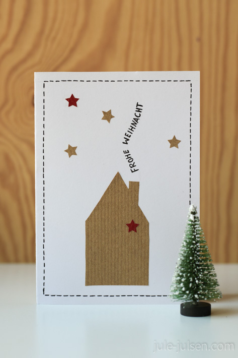 Weihnachtskarte mit Haus und Sternenhimmel aus Papier Weihnachtskarte mit Haus und Sternenhimmel aus Papier